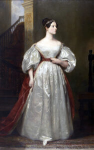 Ein Porträt von Ada Lovelace um 1840, das die Mathematikerin in einem eleganten Kleid mit nachdenklichem Blick zeigt.