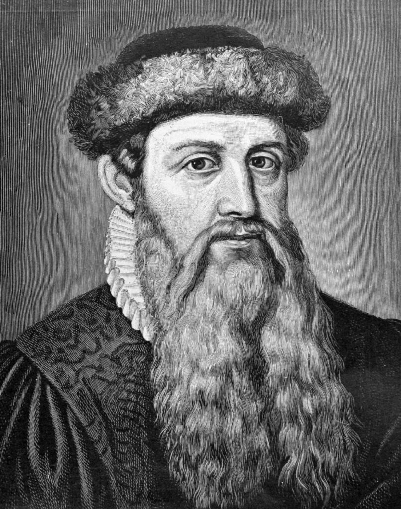 Johannes Gutenberg an seiner Druckerpresse, eine idealisierte Darstellung aus dem 19. Jahrhundert, die den Erfinder bei der Arbeit an der 42-zeiligen Bibel zeigt.