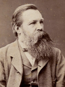 Schwarz-Weiß-Porträt von Friedrich Engels im fortgeschrittenen Alter mit Vollbart, aufgenommen um 1890.