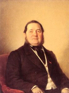 Adalbert Stifter in einer Fotografie um 1860, sitzend in einem Stuhl, mit nachdenklichem Blick und markantem Bart, typisch für das 19. Jahrhundert.